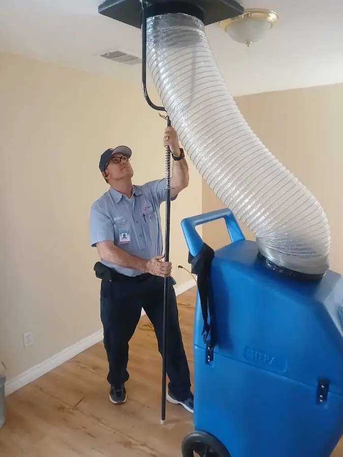Furnace Tune-Up technician using HEPA equipment in Lake Villa